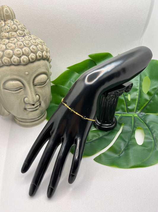 Bracelet Femme Fantaisie en Acier Inoxydable doré - avec ces petites fleurs en perles noir et doré