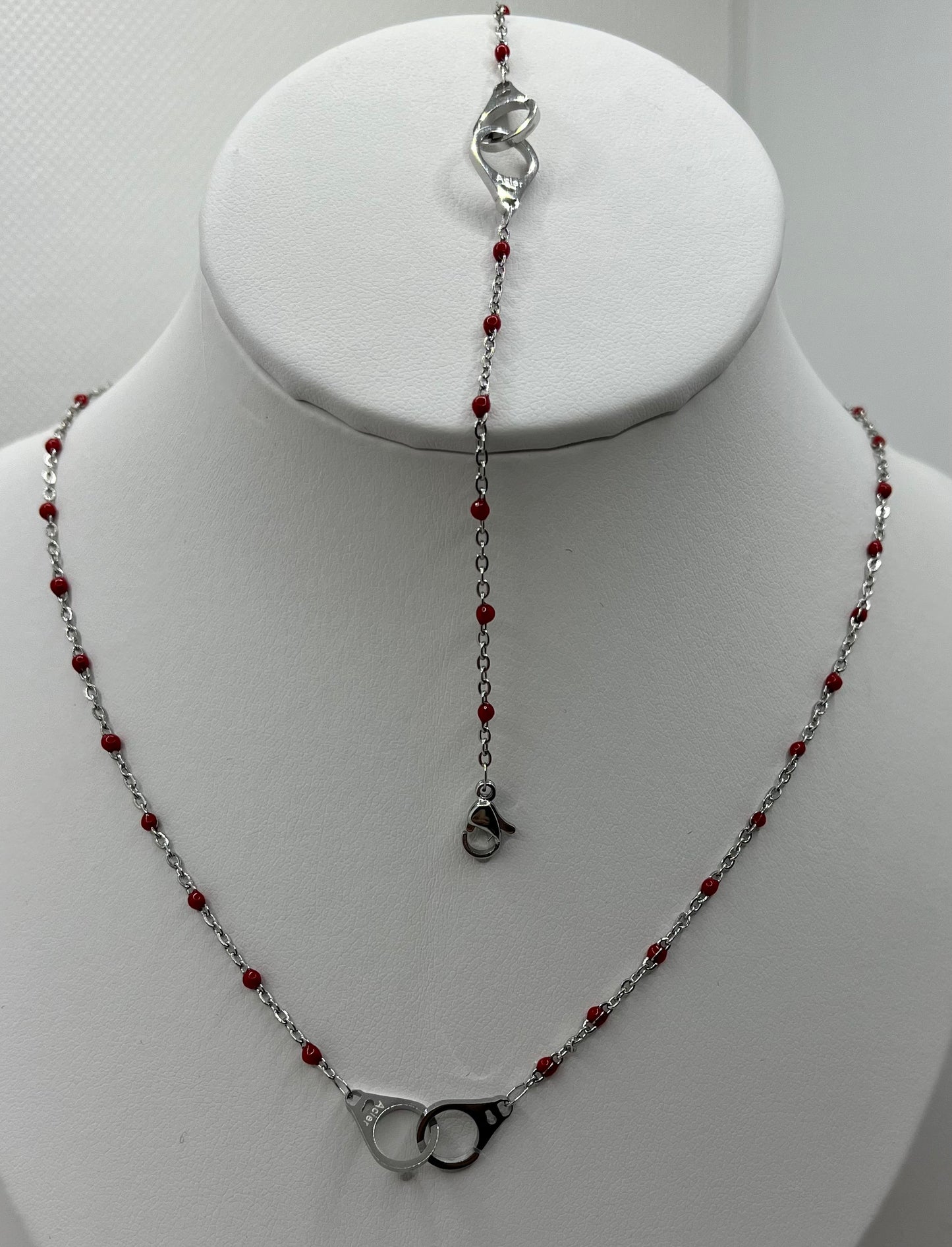 Ensemble Bijoux Femme Collier + Bracelet Chaine fine orné de petites perles rouge et d'un pendentif menotte - Acier inoxydable - Argenté