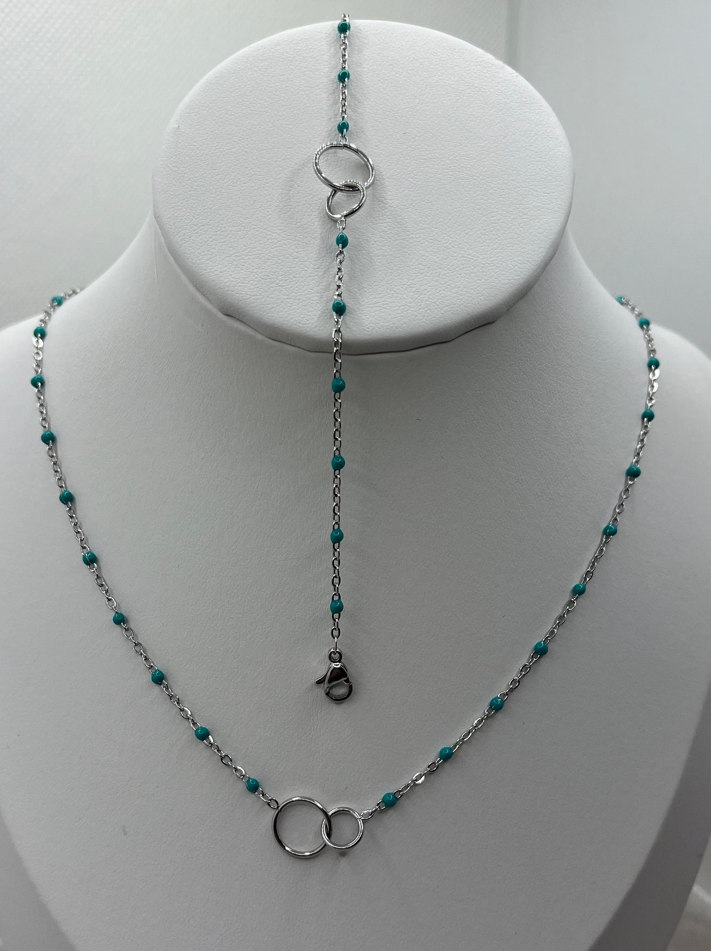 Ensemble Bijoux Femme Collier + Bracelet Chaine fine ornés de petites perles bleu et Pendentif anneau croisés - Acier inoxydable - Argenté
