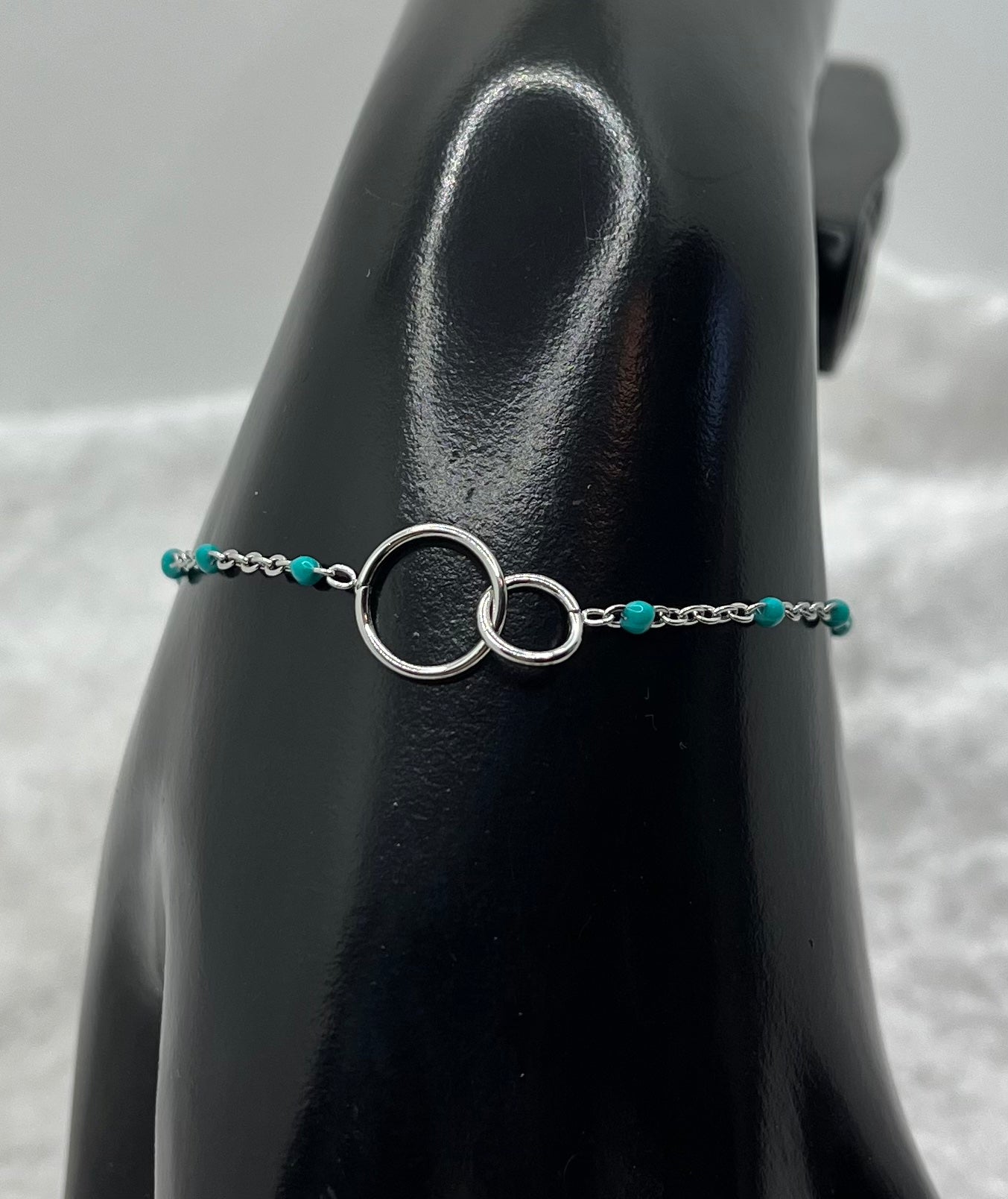 Ensemble Bijoux Femme Collier + Bracelet Chaine fine ornés de petites perles bleu et Pendentif anneau croisés - Acier inoxydable - Argenté